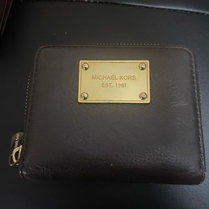 Michael Kors small wallet, black in pre-owned no tear in very good condition